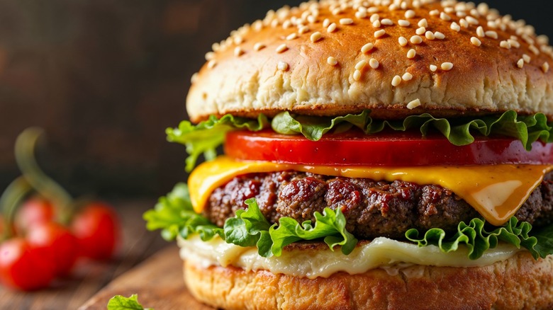 Cheeseburger on wooden serving board