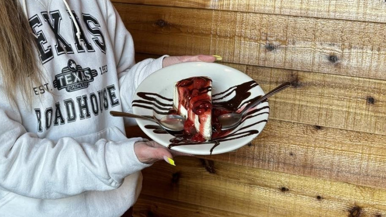 cheesecake with chocolate and strawberry sauce