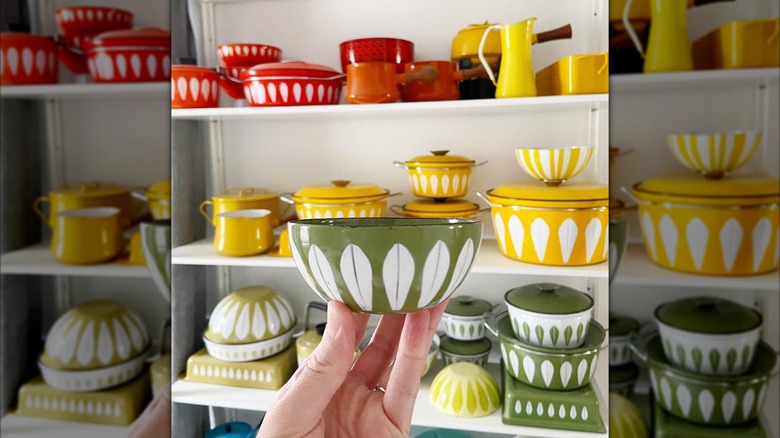 Collection of yellow and sage green Cathrineholm enamel wares.