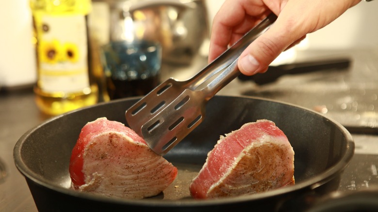 chef searing tuna