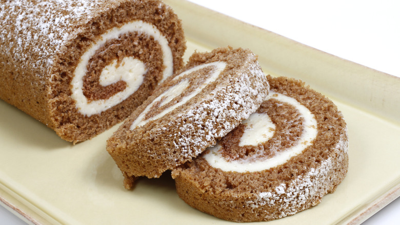 Slices of pumpkin roll on a tray