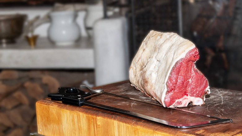 Freshly butchered prime rib on a butcher block