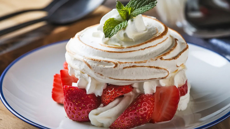 a small strawberry pavlova in a plate