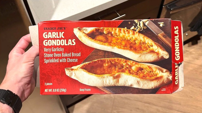 Hand holding a box of Trader Joe's Garlic Gondolas