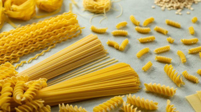 a variety of pasta shapes on a counter