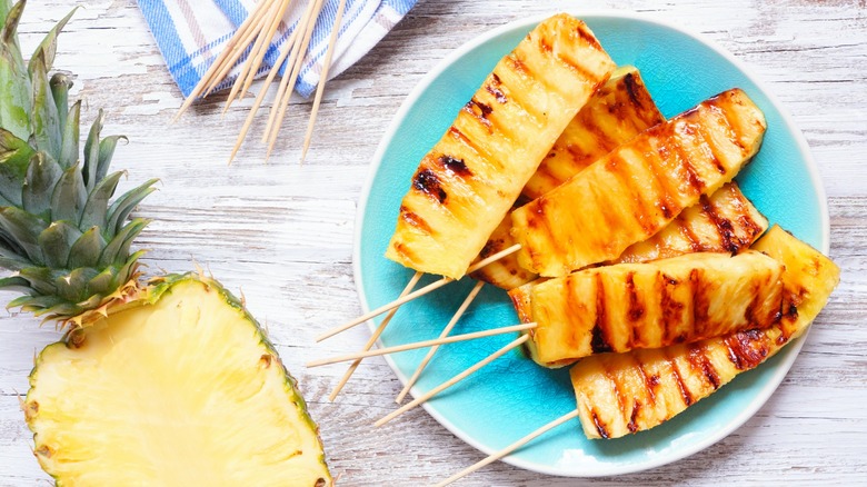 Grilled pineapple spears on a plate