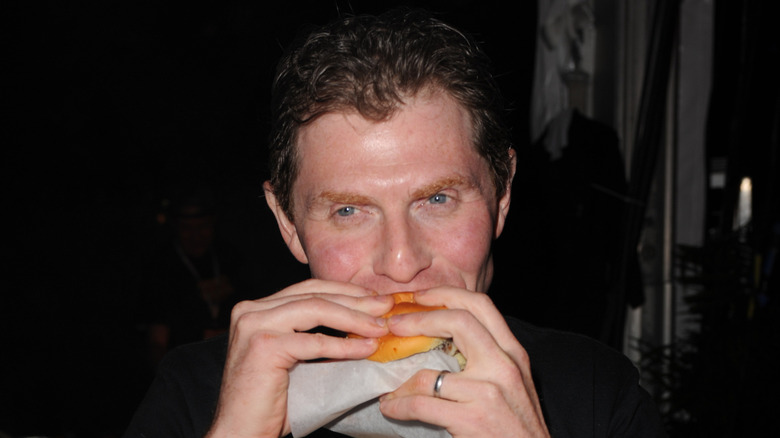 Bobby Flay eating a burger