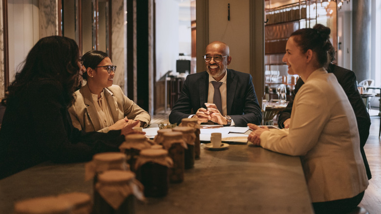 people at a business dinner around a table