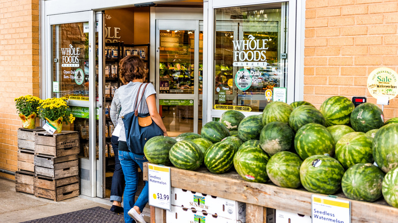 Person walking into Whole Foods