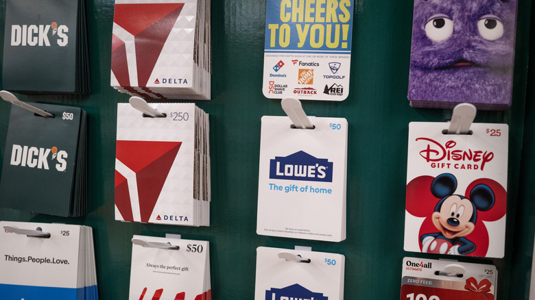 A series of gift cards on a store shelf.