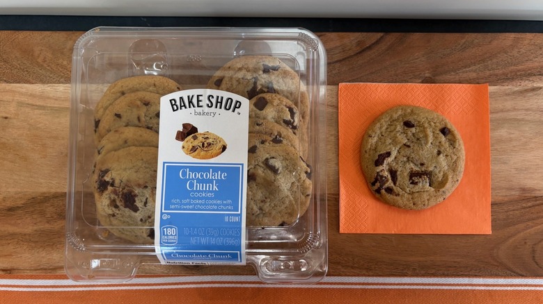 Aldi Bake Shop Chocolate Chunk Cookie package next to cookie on orange napkin