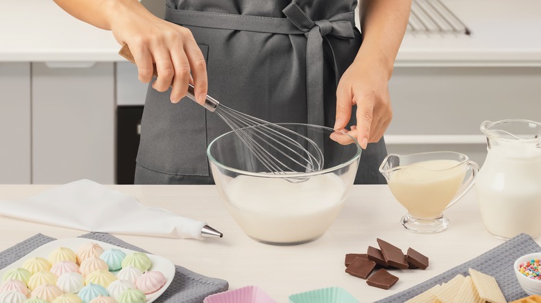 Woman with whisk and bowl