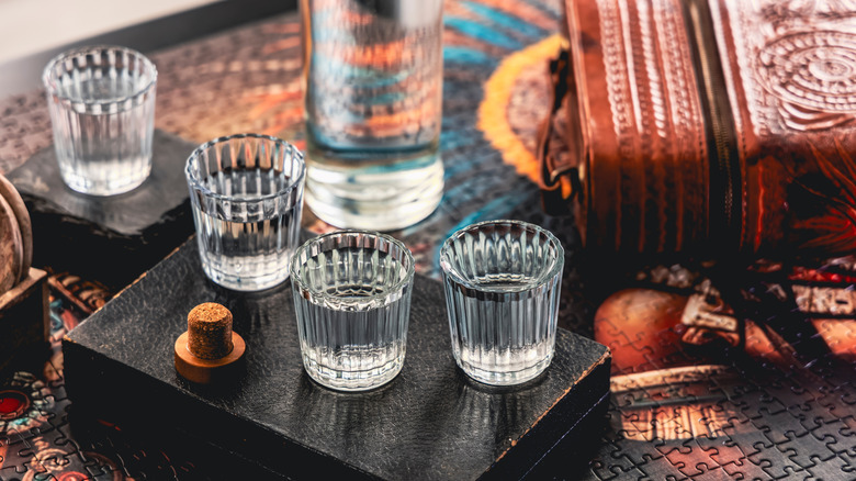 Glasses of mezcal on a table