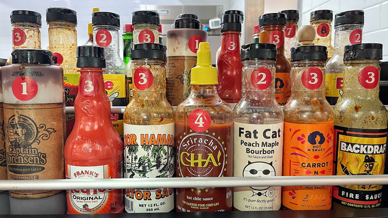 Assortment of numbered hot sauce bottles at Firehouse Subs
