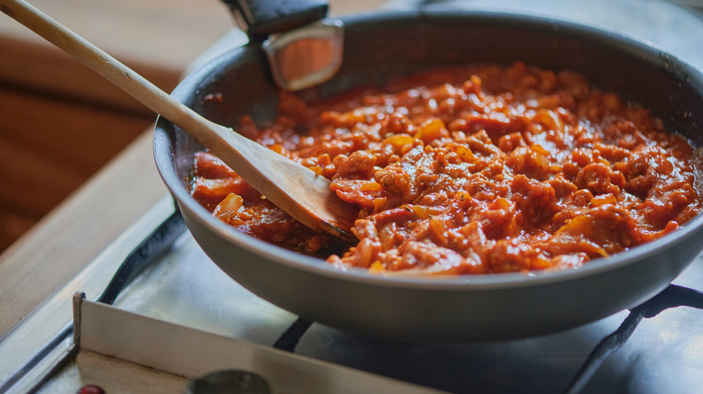 ragu sauce in a pan on the stovetop