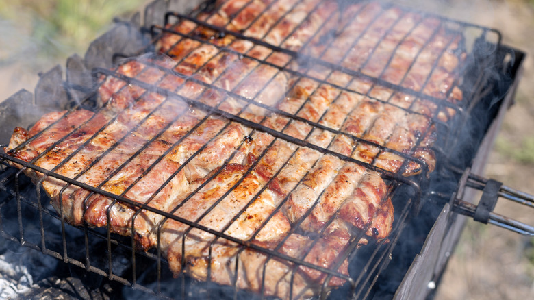 Pork steaks being grilled