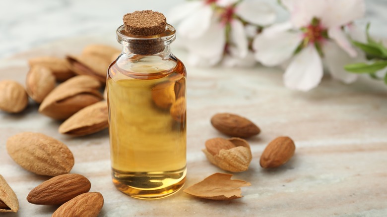 Bottle of almond extract and almonds