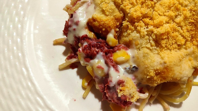 corned beef casserole made with corned beef, corn, cream of mushroom soup, parmesan cheese, and spaghetti