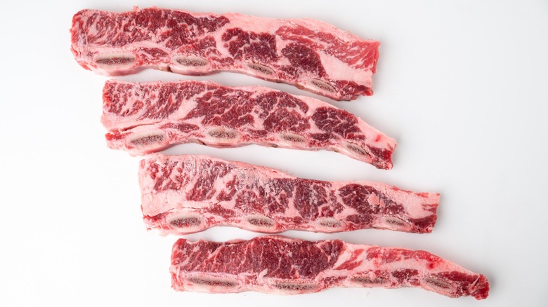 Four raw flanken short ribs