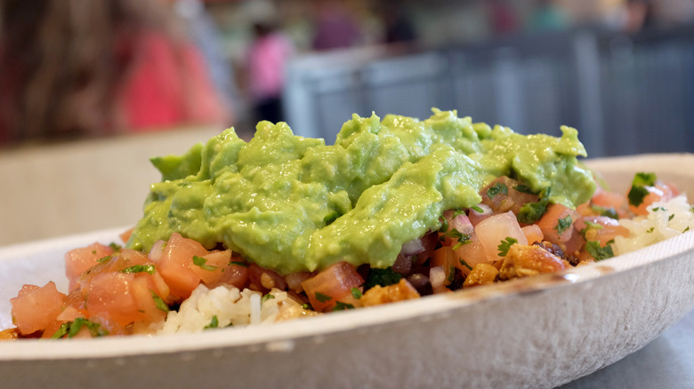 Guacamole on top of a Chipotle burrito bowl