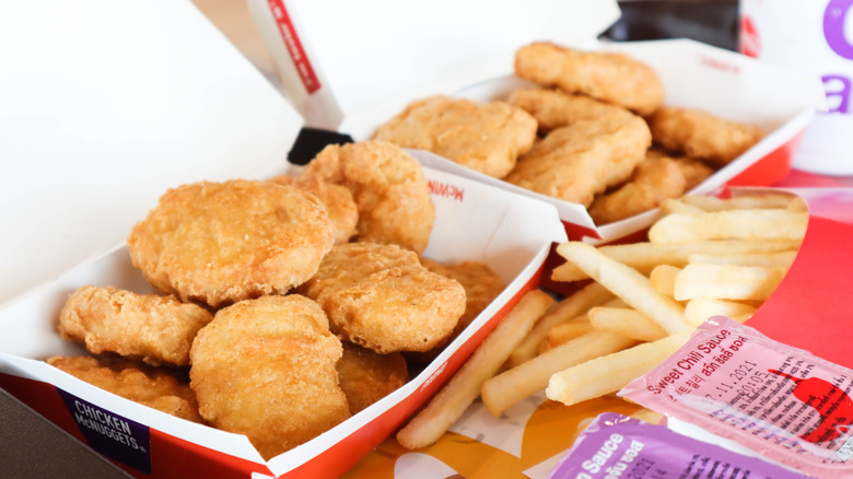 Chicken McNuggets with fries and sauce packets