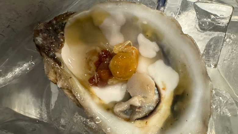 Close up of oyster or pea crabs in an open oyster shell
