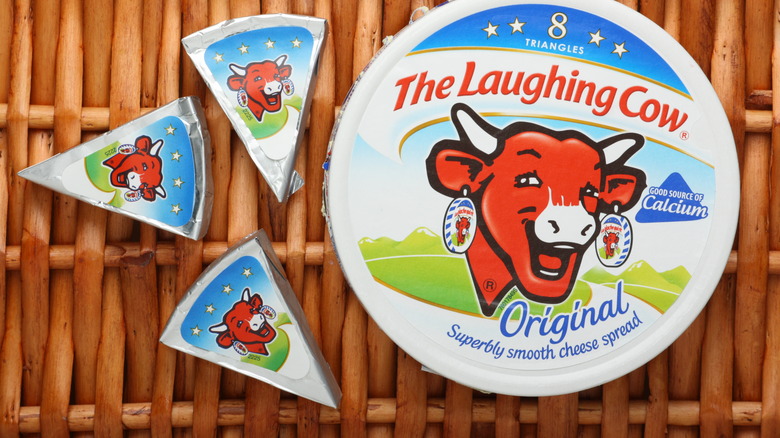 a package of Laughing Cow cheese on basket-like background