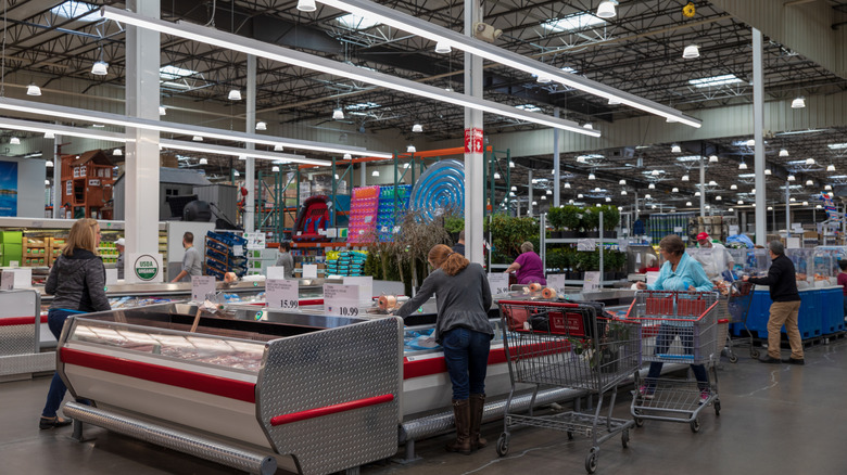 Customers shopping inside a Costco warehouse