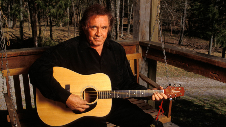 A young Johnny Cash with his guitar