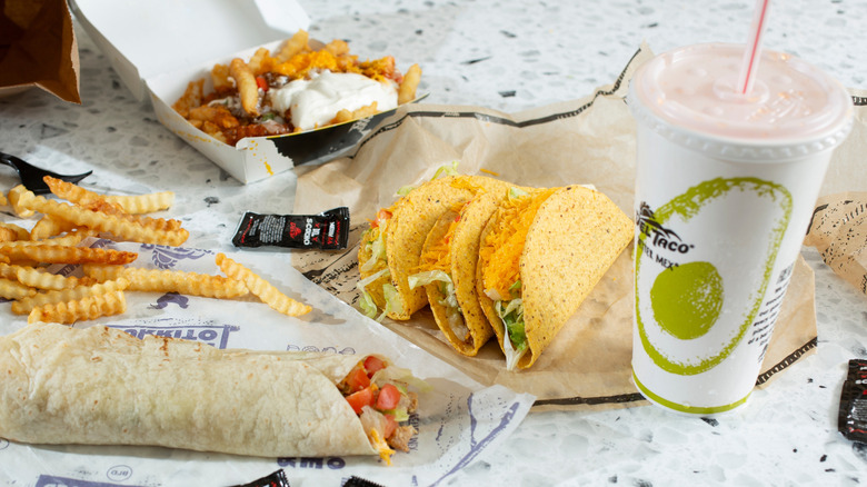 Del Taco combo meal with tacos, fries, and a soda