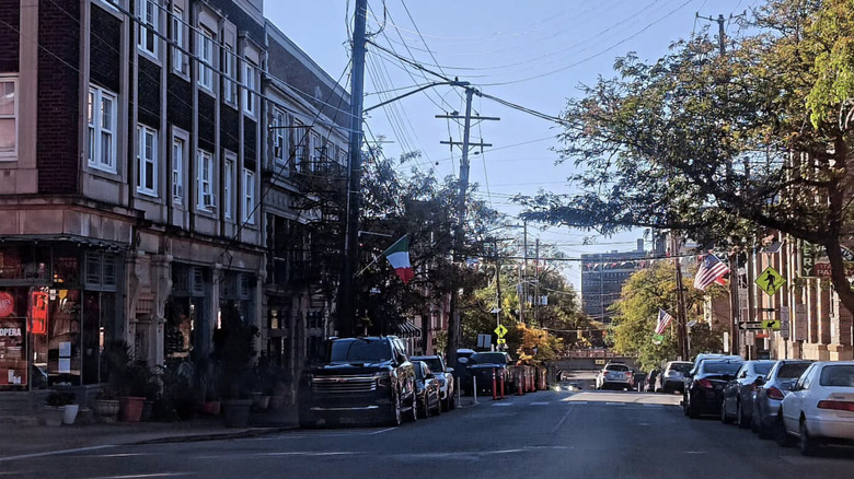 Cars are parked on a street in Cleveland's Little Italy