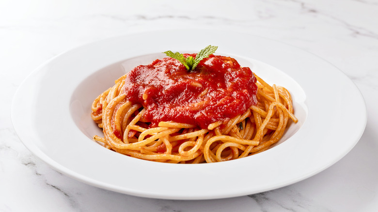 Tomato ketchup over spaghetti