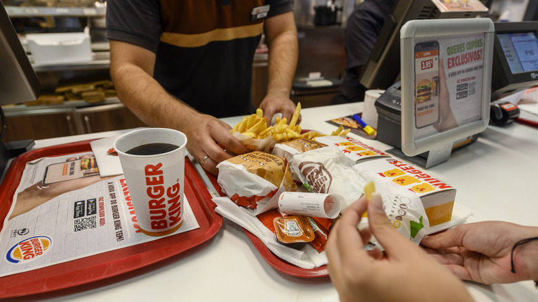 Burger King staff serving a customer