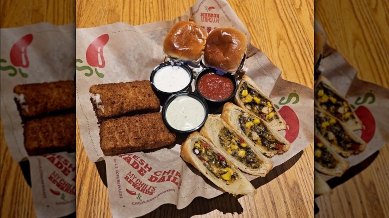 Chili's triple dipper with mozzarella sticks, sliders, and Southwestern egg rolls