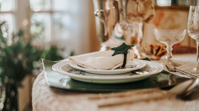 A place setting on a dining room table in profile.