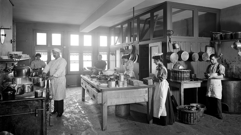 Staff cooking in a professional kitchen in the 1800s