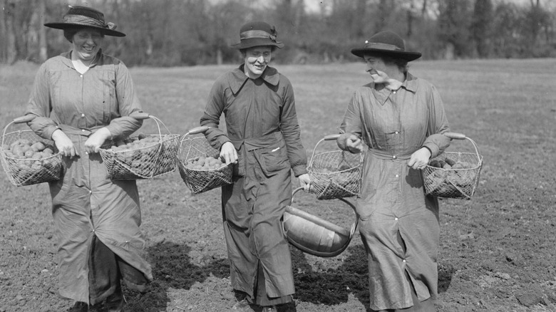Women with baskets of potatoes during WWI