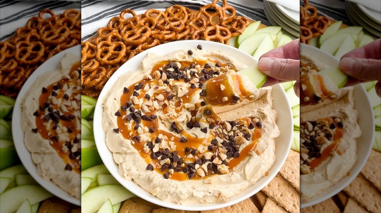 Salted caramel apple cheesecake dip in a bowl next to pretzels and green apples.