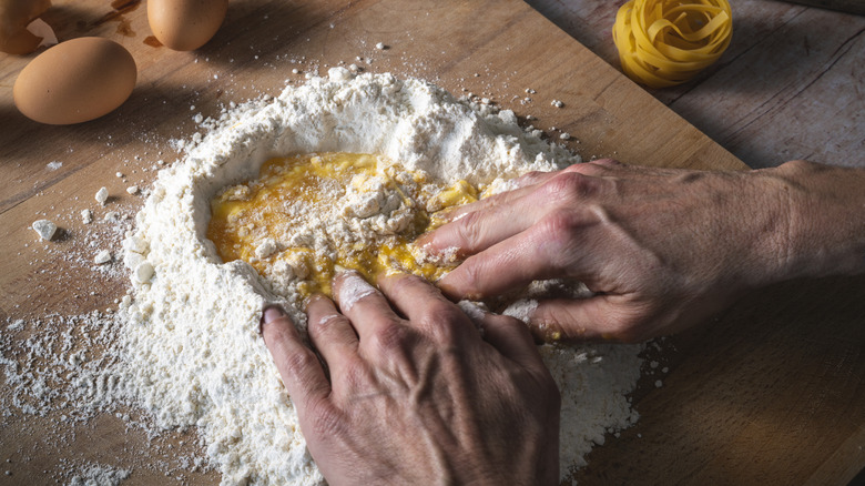 Making pasta with flour, eggs