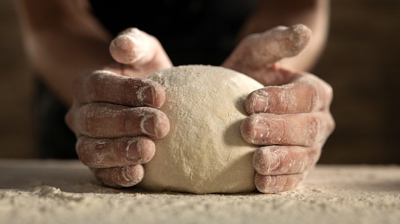 Shaping mound of pasta dough