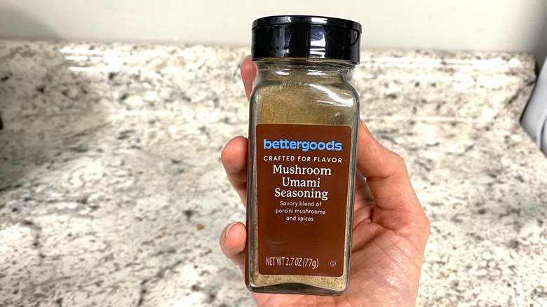 hand holding Walmart's BetterGoods Mushroom Umami Seasoning