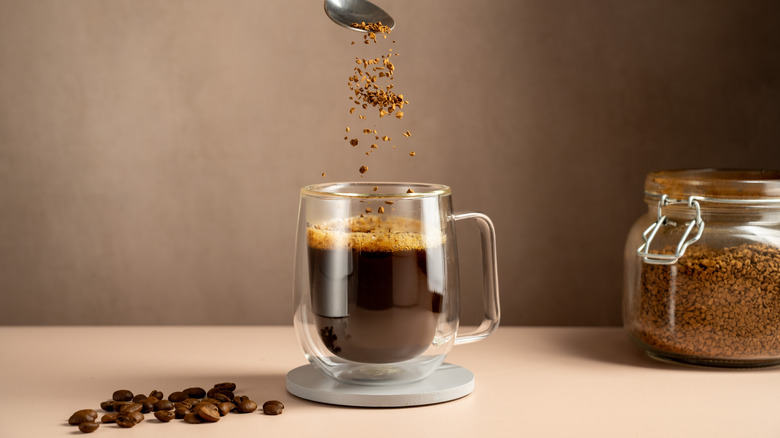instant coffee pouring into cup