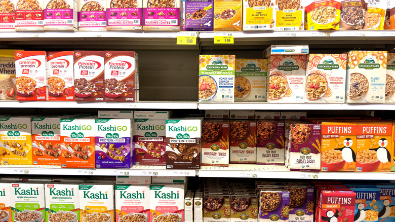 Cereals are displayed on a shelf at Wegmans