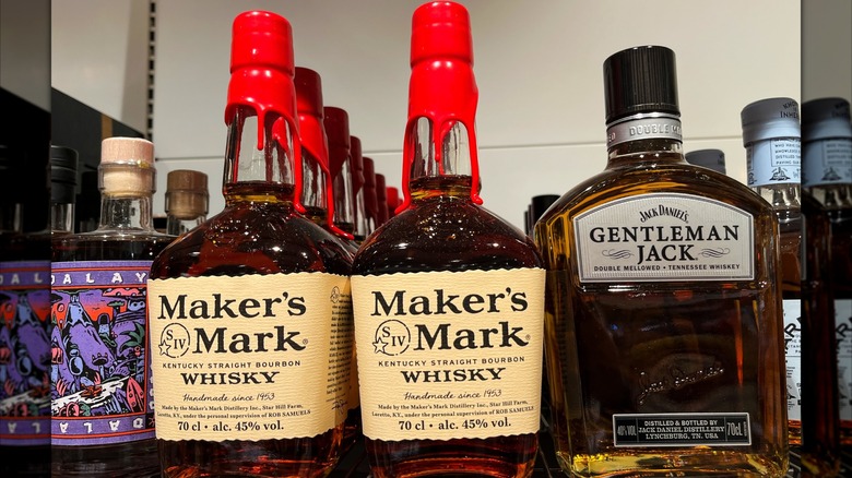 Bottles of Maker's Mark and Gentleman Jack on a store shelf