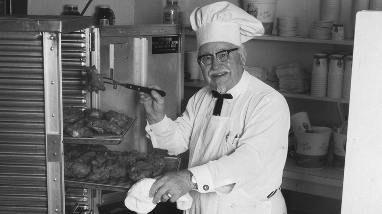 Colonel Sanders with rotisserie chicken