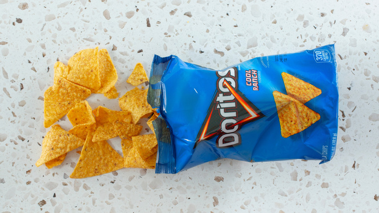 a bag of cool ranch doritos with some chips spilled out