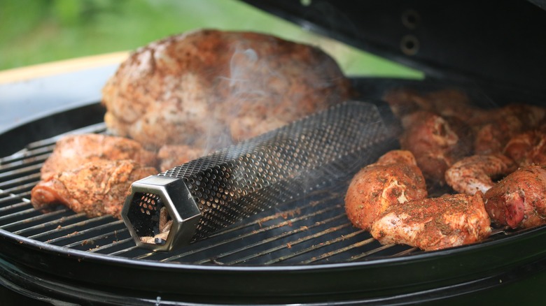 Grill with meat and wood pellet tube