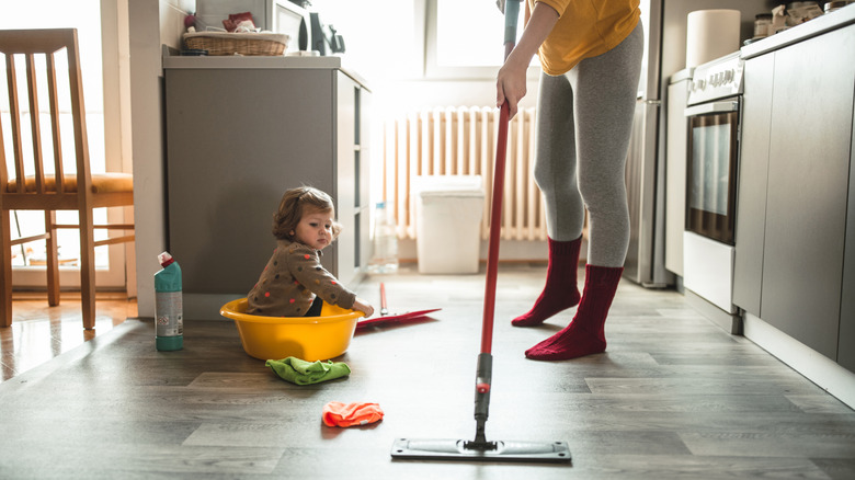 Woman mopping kitchen floors