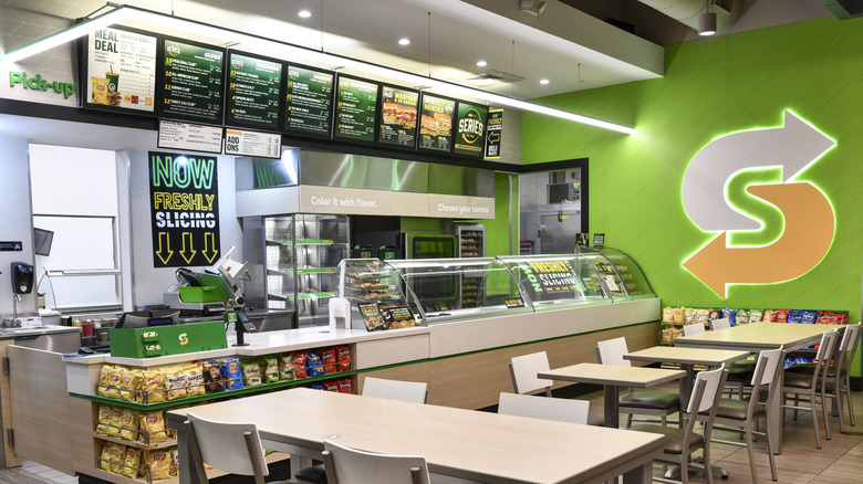 The interior of an empty Subway restaurant