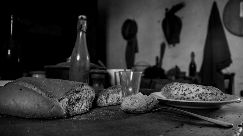 A black and white photo of a wartime meal on a table